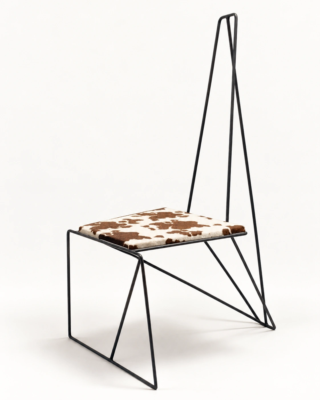 Rawhide chair designed in California with a tall blackened-steel rod frame and natural brown-and-white hair-on hide seat